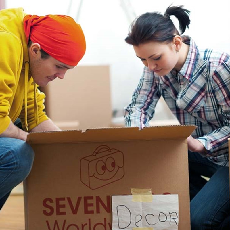 Couple packing cardboard boxes