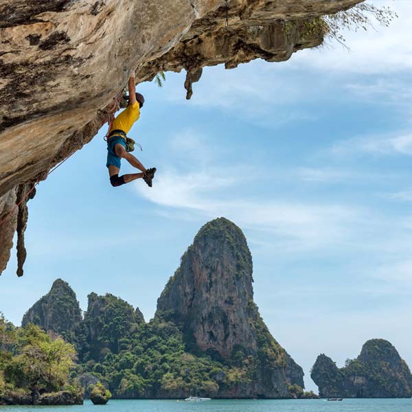 Man rock climbing in Thailand