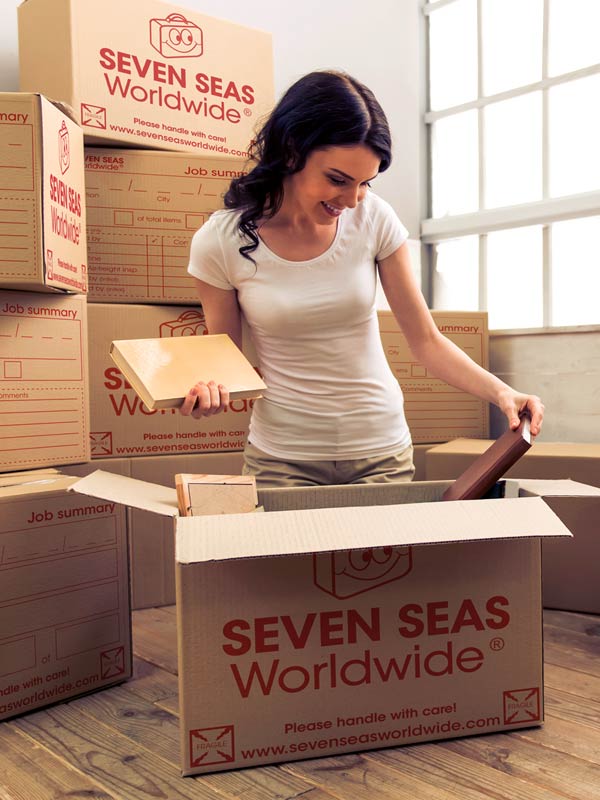 Woman packing a box with books