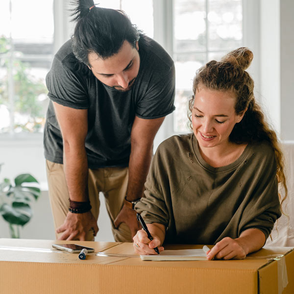 couple completing packing list