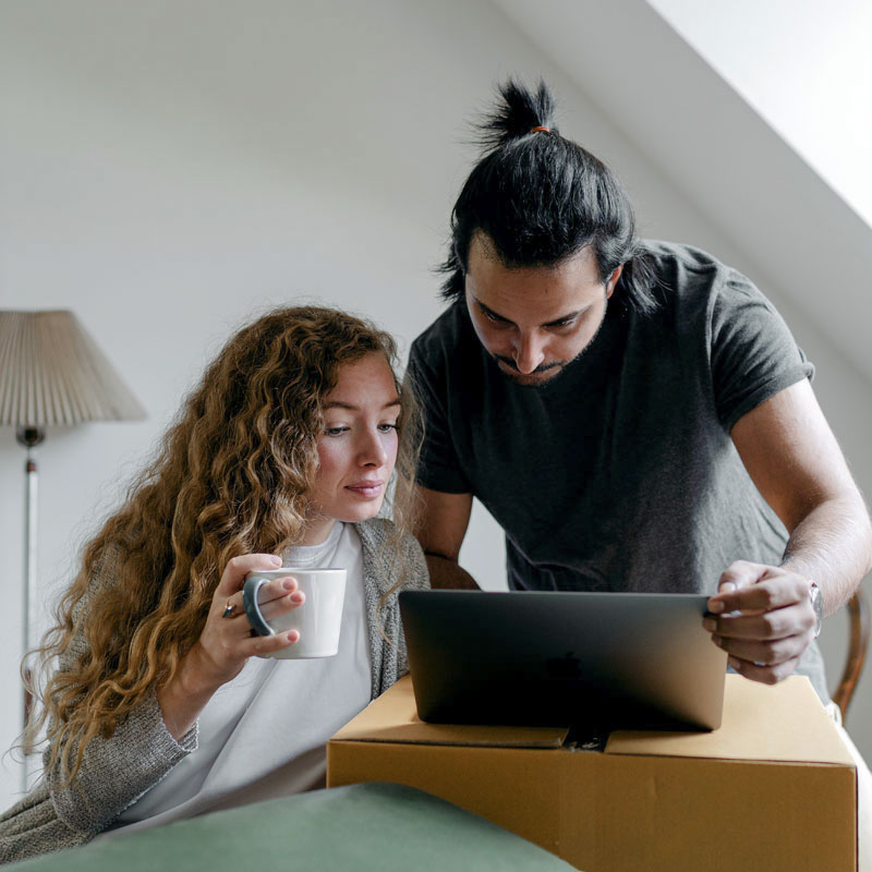 Couple booking on a laptop